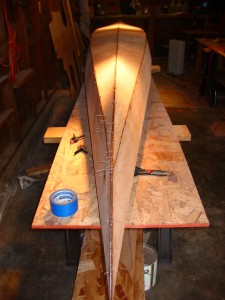 This picture was taken last Sunday morning. If you look closely (click on the picture for a better look), you can see the wires sticking out of the seams, and the epoxy patches are fairly obvious. It's definitely looks like a kayak, but it's still ugly.